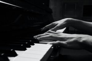 cropped-hands-playing-piano